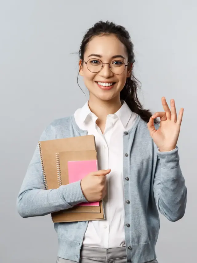 portrait-smiling-young-woman-standing-against-white-background