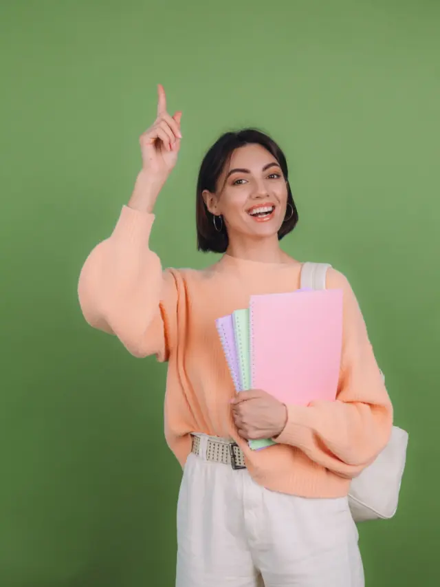 young-woman-casual-peach-sweater-isolated-green-olive-color-wall